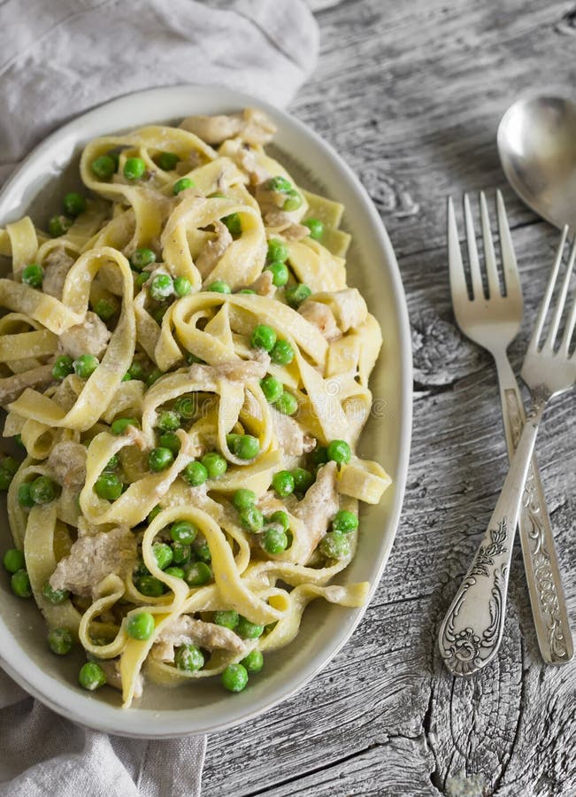 Homemade Pasta With Green Peas, Chicken Breast And Cream Sauce Stock