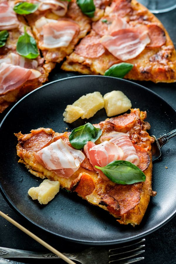 Homemade Pepperoni Pizza Served on Plate with Fresh Bacon Stock Photo