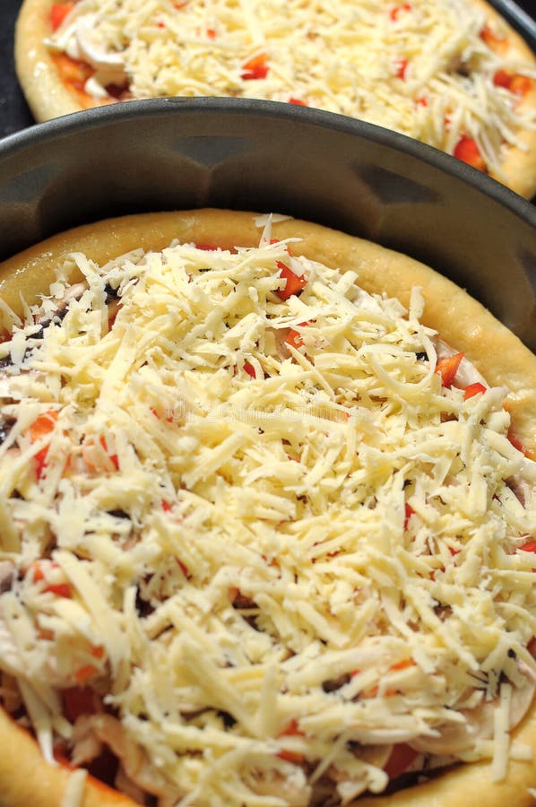 Homemade Pizza, Process of Cooking. Layer of Grated Cheese Stock Image