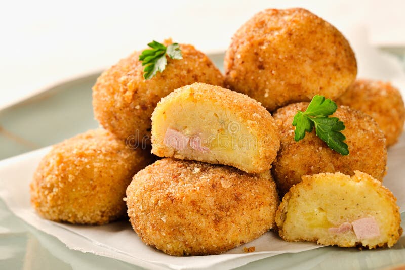 Homemade POTATO CROQUETTES Stuffed with Ham and Cheese Stock Photo