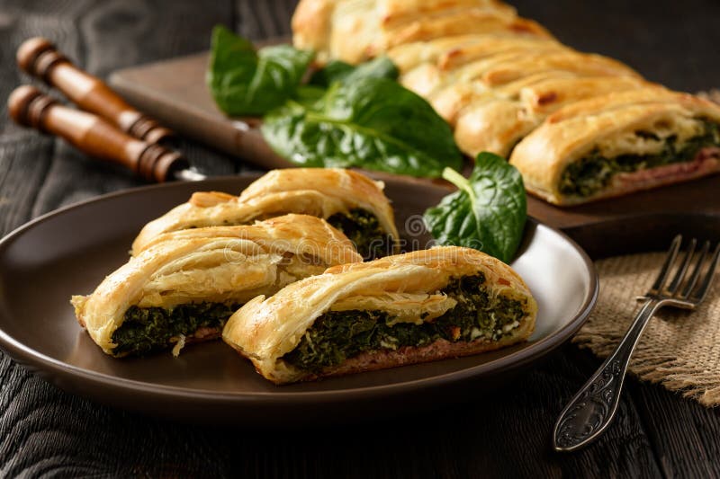 Homemade Puff Pastry Pie with Spinach, Ham and Cheese. Stock Photo