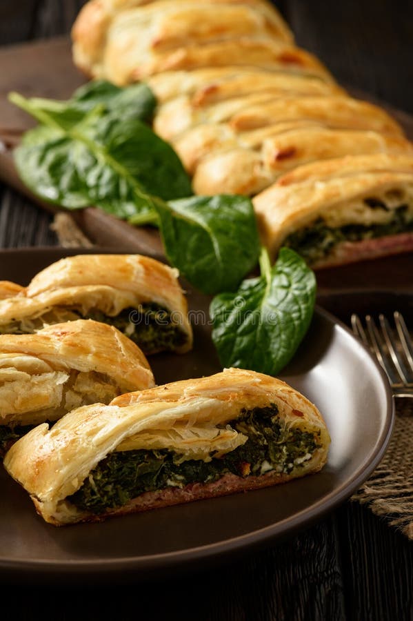 Homemade Puff Pastry Pie with Spinach, Ham and Cheese. Stock Photo