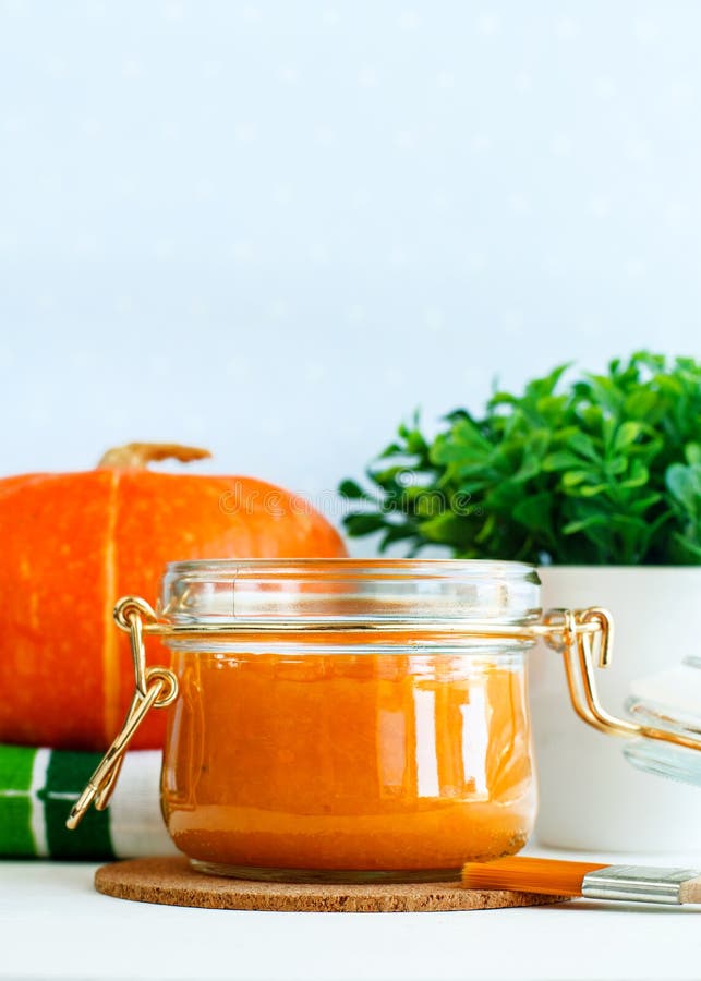 Homemade pumpkin face mask in a glass jar. DIY cosmetics and spa. Copy space. stock images Homemade pumpkin face mask in a glass jar. DIY cosmetics and spa. Copy space. stock images