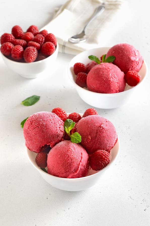 Raspberry Ice Cream Scoop with Fresh Raspberries and Fresh Berry in