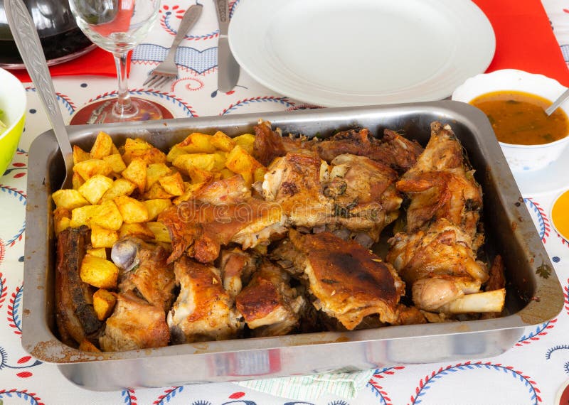 Homemade roasted goatling/roasted kid `cabrito assado` with potatoes ready to eat. It is a traditional portuguese dish. Homemade recipe. Roasting tray stock images, royalty-free photos and pictures