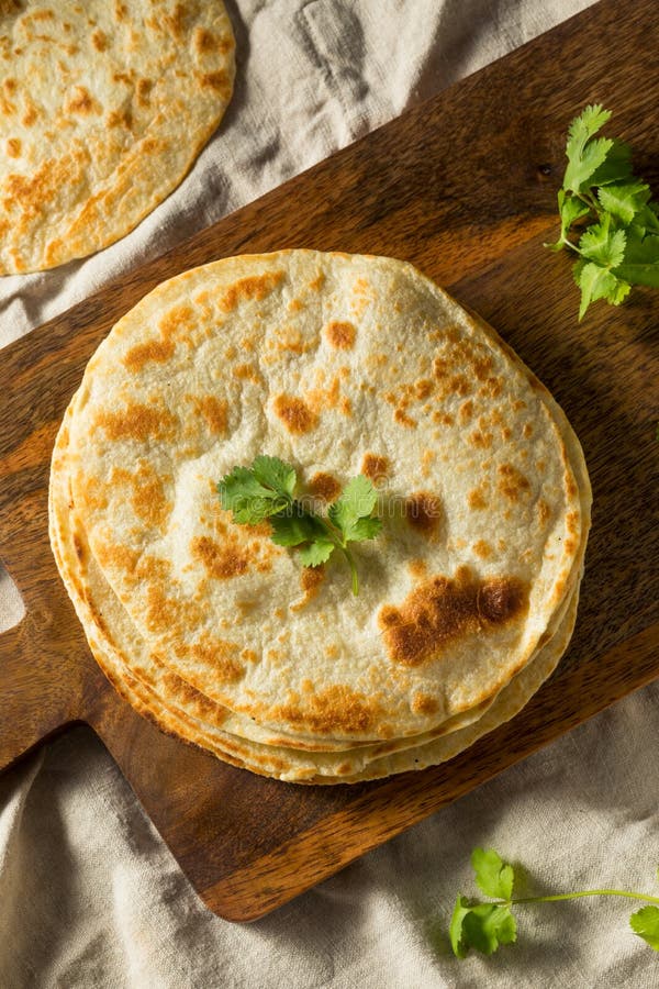 Homemade Roti Chapati Flatbread on a Rustic Wooden Board, Top View