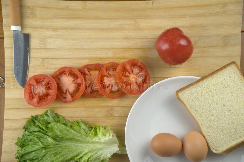 Homemade Sandwich, Tomatoes, Slice of Bread, Eggs, Lettuce. Simple Breakfast Style Stock Image
