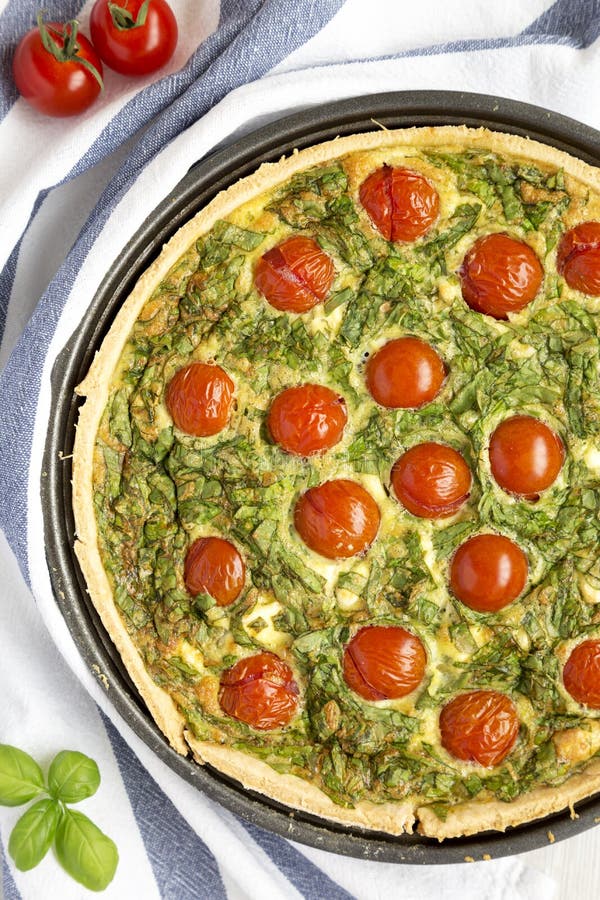 Homemade Spinach Quiche in a Baking Dish, Top View. Flat Lay, Overhead