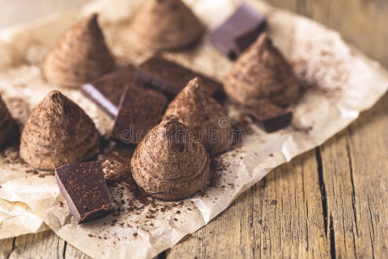 Homemade Tasty Chocolate Truffle Candy on the Old Wooden Background Tasty Dessert Horizontal Toned stock images Homemade Tasty Chocolate Truffle Candy on the Old Wooden Background Tasty Dessert Horizontal Toned stock images
