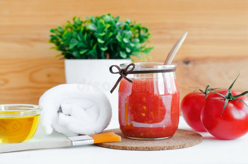 Homemade tomato face mask in a glass jar. Diy cosmetics.