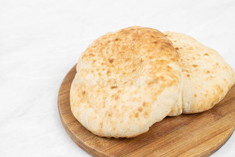 Homemade traditional lepinja bread on the wooden board