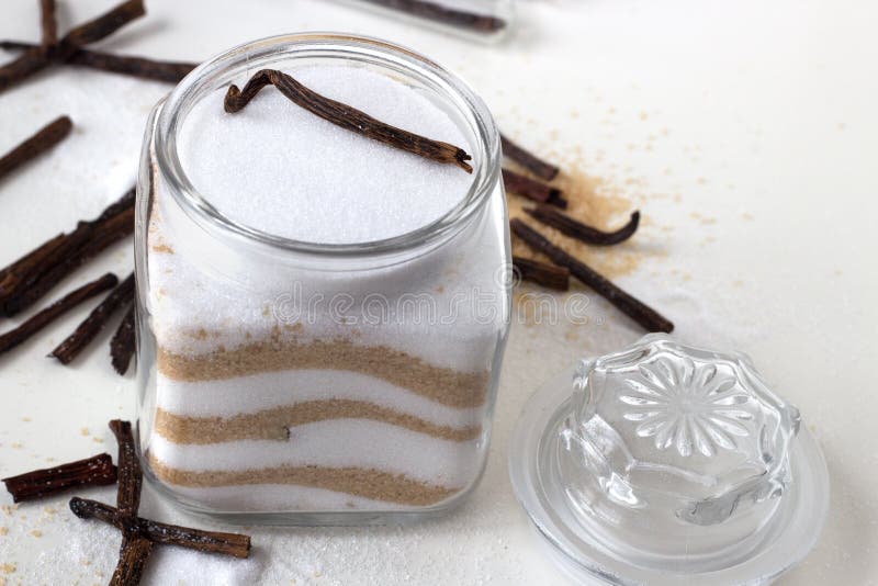 Homemade vanilla white and brown sugar in a glass jar with vanilla sticks. Homemade vanilla white and brown sugar in a glass jar with vanilla sticks