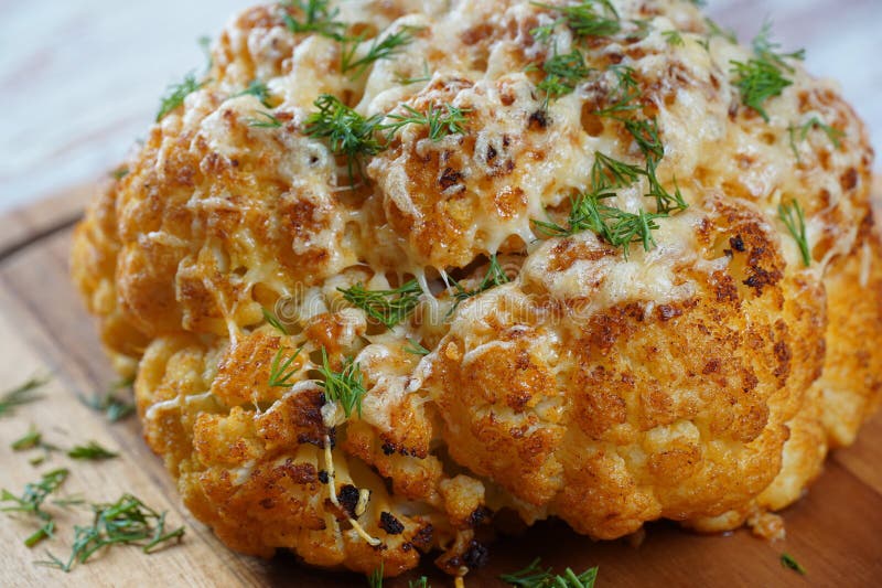 Homemade Whole Roasted Cauliflower with Cheese and Herbs Stock Image
