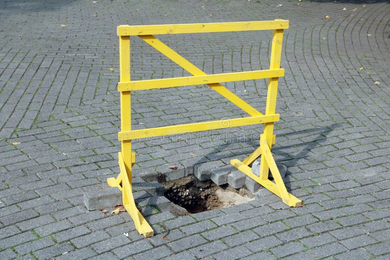 A homemade wooden yellow barrier