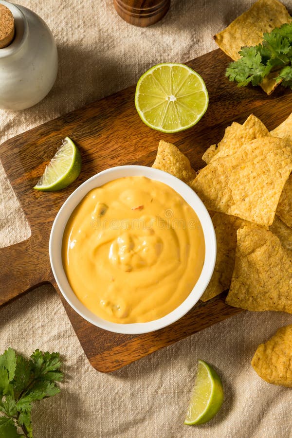 Homemade Yellow Queso Cheese Dip with Tortilla Chips Stock Photo