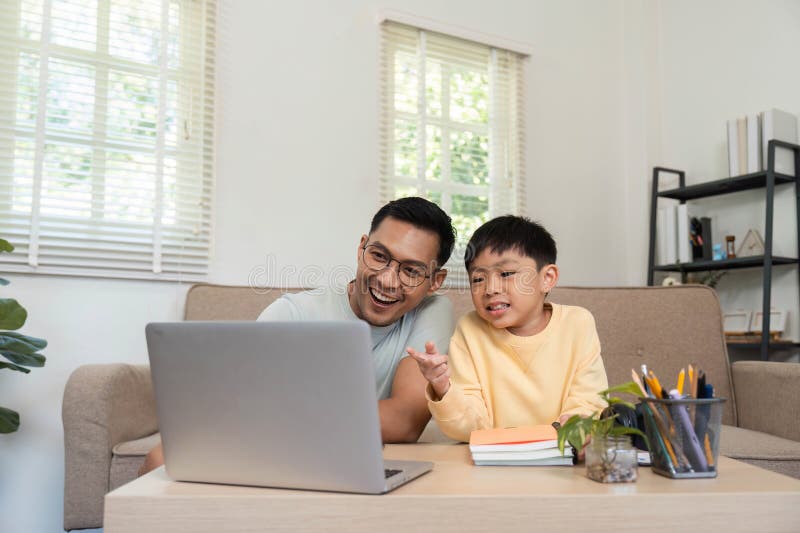 Homeschooling experience with father and son enjoying learning royalty free stock photography
