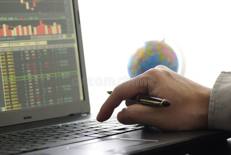 Business man checking stock diagram in office. Business man checking stock diagram in office