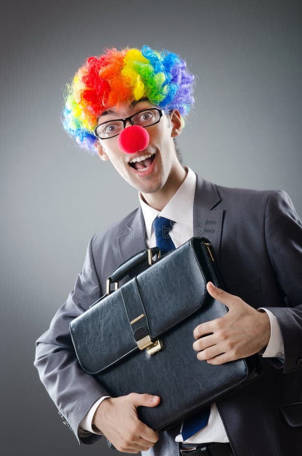 Homme d'affaires de clown - concept d'affaires drôles photographie stock libre de droits Homme d'affaires de clown - concept d'affaires drôles photographie stock libre de droits