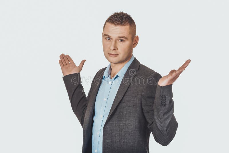 Homme d'affaires faisant le geste irrésolu photographie stock Homme d'affaires faisant le geste irrésolu photographie stock