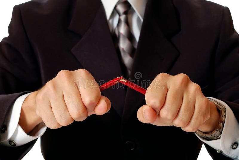 Homme d'affaires fâché cassant le crayon photo stock Homme d'affaires fâché cassant le crayon photo stock