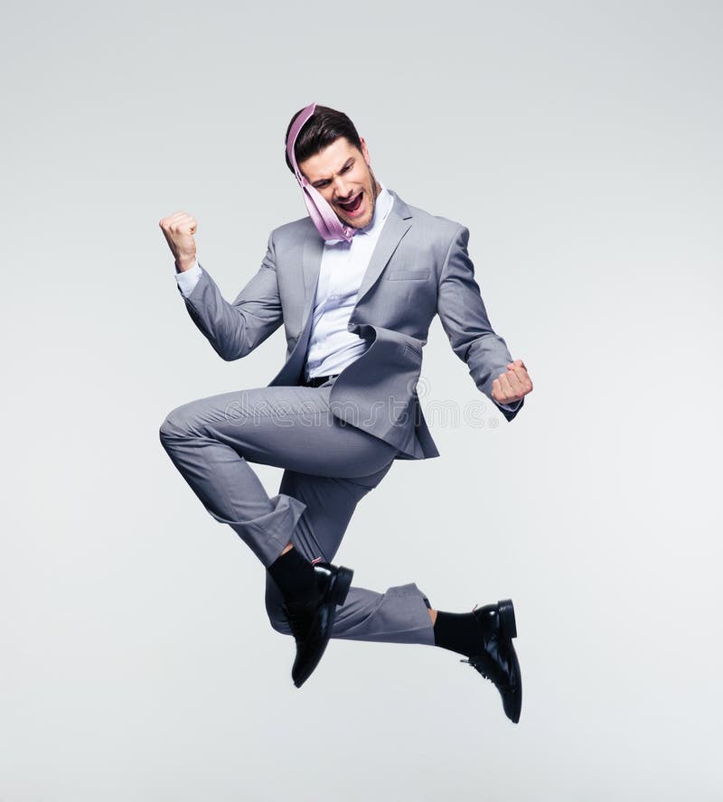 Homme d'affaires heureux branchant en air photo libre de droits Homme d'affaires heureux branchant en air photo libre de droits