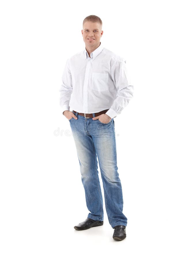 Casual businessman standing with hands in pocket, smiling at camera, cutout, full size. Casual businessman standing with hands in pocket, smiling at camera, cutout, full size.