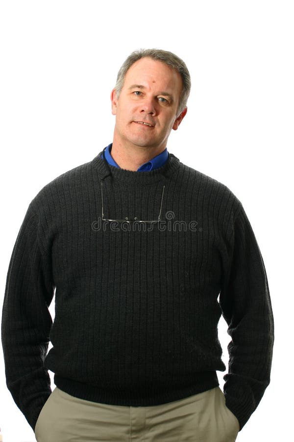 Casual Businessman wearing sweater with welcoming smile and hands in pockets. Casual Businessman wearing sweater with welcoming smile and hands in pockets