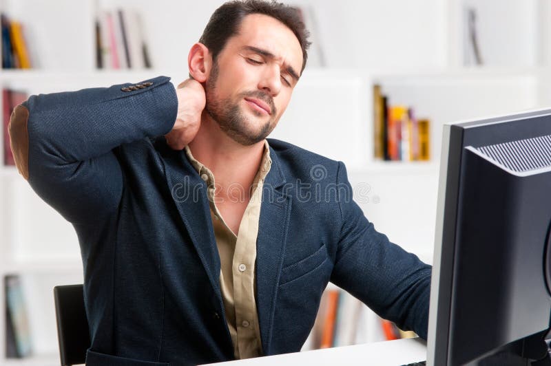 Casual businessman sitting in a desk with pain in his neck. Casual businessman sitting in a desk with pain in his neck