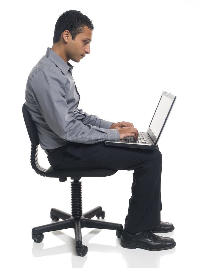 Homme d'affaires - présidence d'ordinateur portatif image libre de droits Homme d'affaires - présidence d'ordinateur portatif image libre de droits