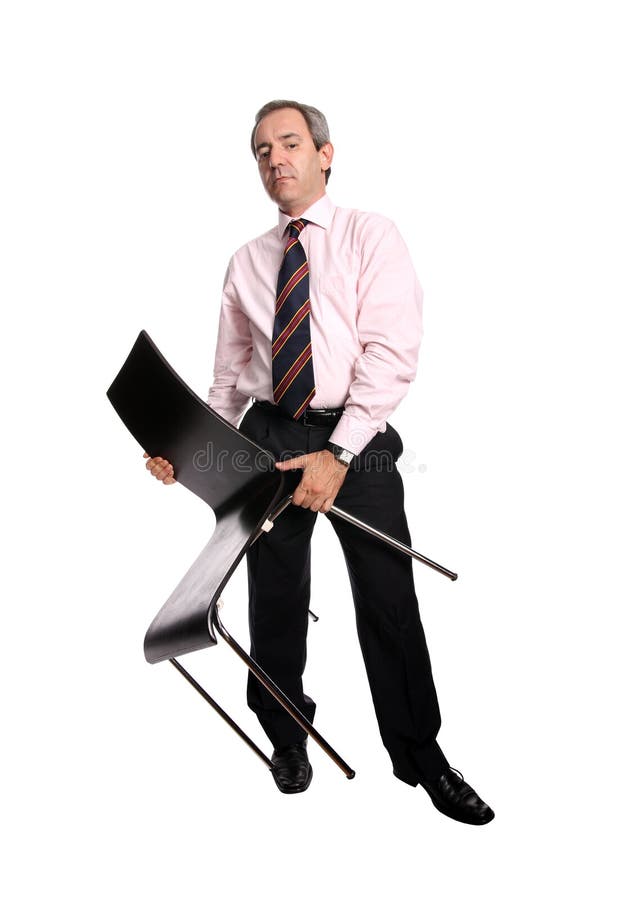 Homme d'affaires retenant une présidence image stock Homme d'affaires retenant une présidence image stock