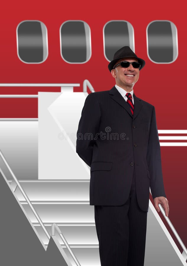 Homme d'affaires se tenant sur des escaliers à l'avion images stock Homme d'affaires se tenant sur des escaliers à l'avion images stock