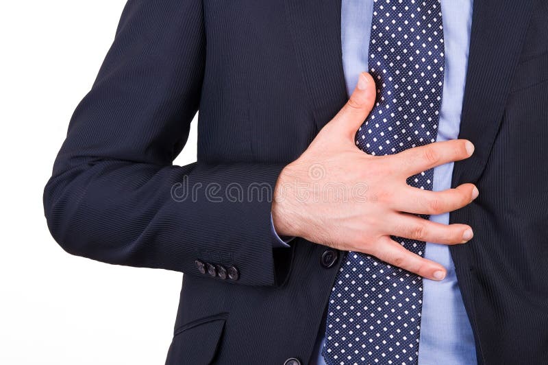 Image of a businessman suffering from heartburn. Image of a businessman suffering from heartburn.