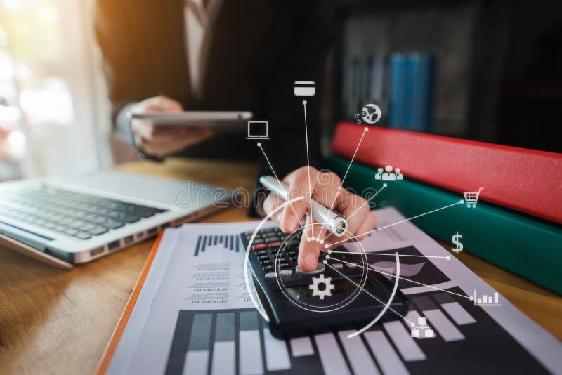 Close up of businessman working on calculator to calculate financial data report, accountancy document and laptop computer at office, business concept. Close up of businessman working on calculator to calculate financial data report, accountancy document and laptop computer at office, business concept.