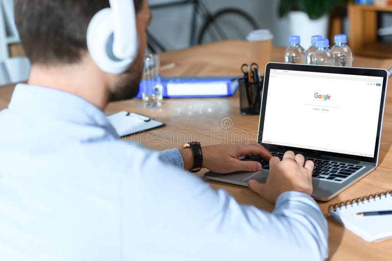 businessman using laptop with loaded google page. businessman using laptop with loaded google page