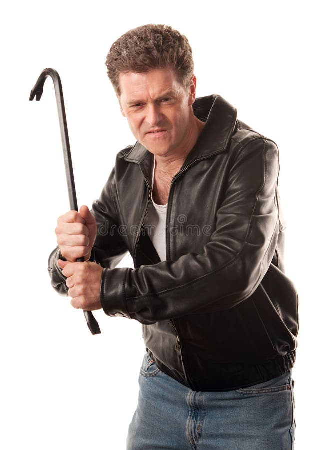 Angry man in leather jacket ready to strike with a crowbar. Angry man in leather jacket ready to strike with a crowbar
