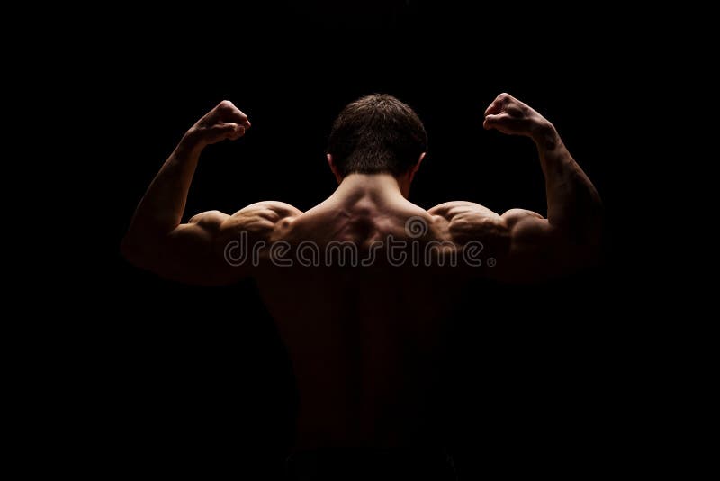 Homme musculaire fort montrant ses mains, épaules, cou, biceps et muscles du dos Concept de forme physique Lumière excessive images libres de droits Homme musculaire fort montrant ses mains, épaules, cou, biceps et muscles du dos Concept de forme physique Lumière excessive images libres de droits