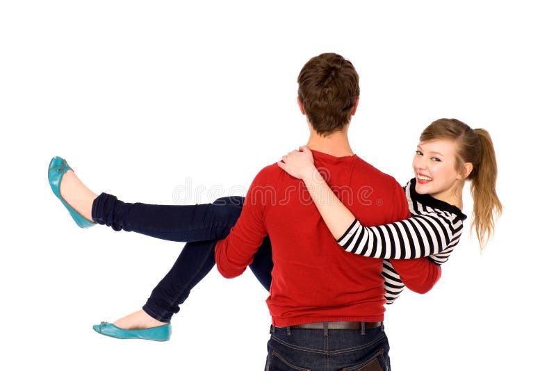 Homme portant sa amie dans des ses bras photos libres de droits Homme portant sa amie dans des ses bras photos libres de droits