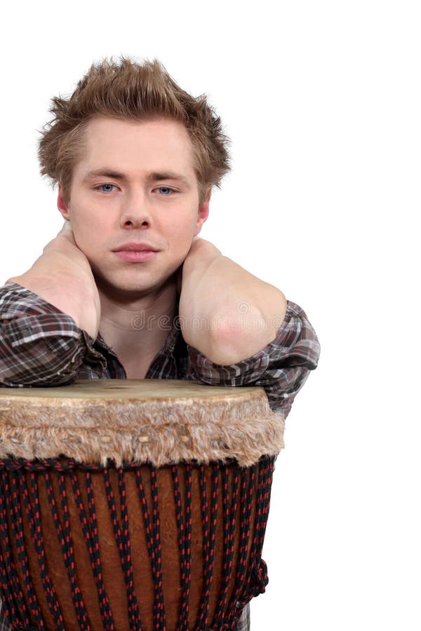 Man posing with his djembe drum. Man posing with his djembe drum