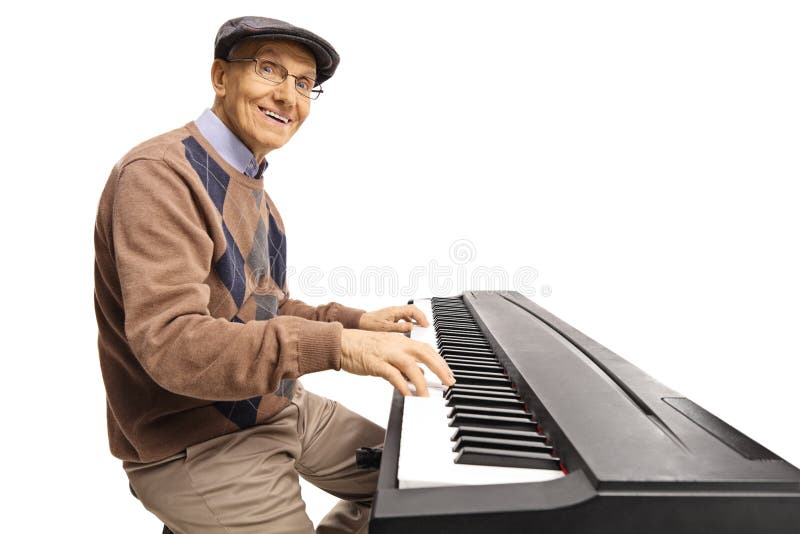 Homme supérieur gai jouant un piano numérique de clavier image libre de droits