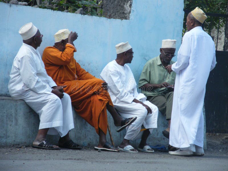 Chatting men near a mosque in the capital city of the Comoros islands, Moroni. Chatting men near a mosque in the capital city of the Comoros islands, Moroni