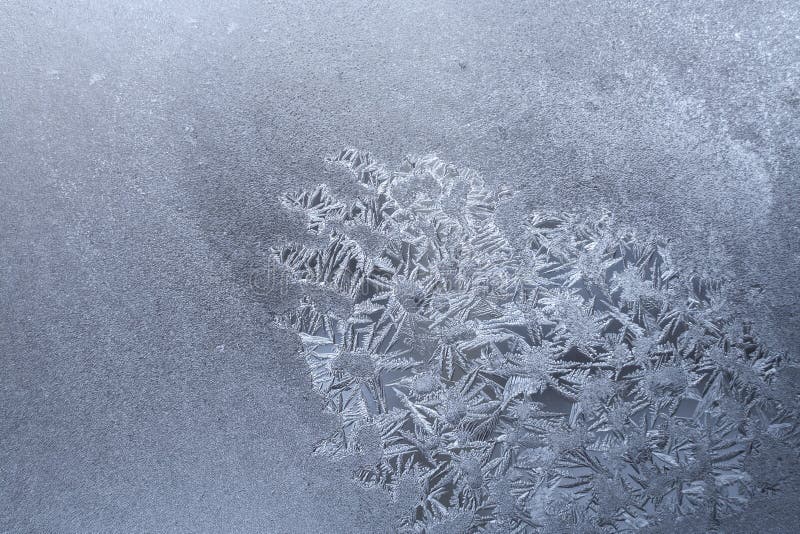Homogeneous white frozen window with spot of frosty pattern of snowflakes. Homogeneous white frozen window with spot of frosty pattern of snowflakes as royalty free stock image Homogeneous white frozen window with spot of frosty pattern of snowflakes. Homogeneous white frozen window with spot of frosty pattern of snowflakes as royalty free stock image