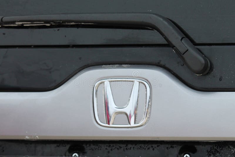 Honda car logo closeup on the grille close-up.