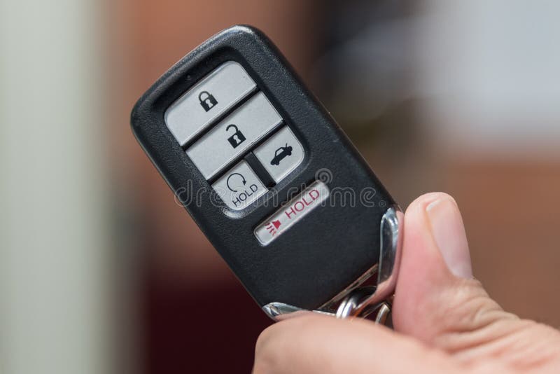 Remote Key FOB for modern car in hand