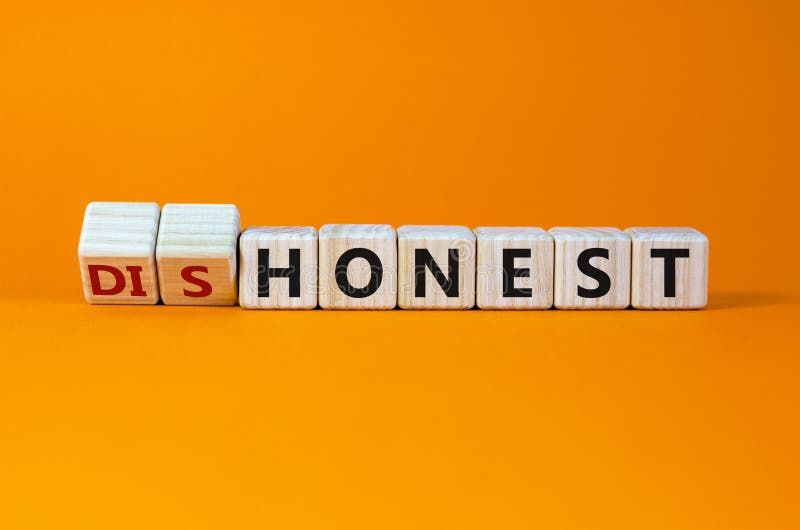 Honest or dishonest symbol. Turned cube and changed the word `dishonest` to `honest`. Beautiful orange background. Business an stock photo