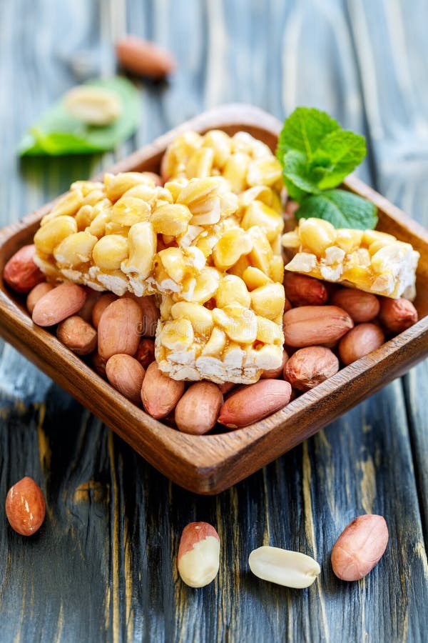 Honey Bars with Peanuts in Bowl with a Whole Peanut. Stock Photo