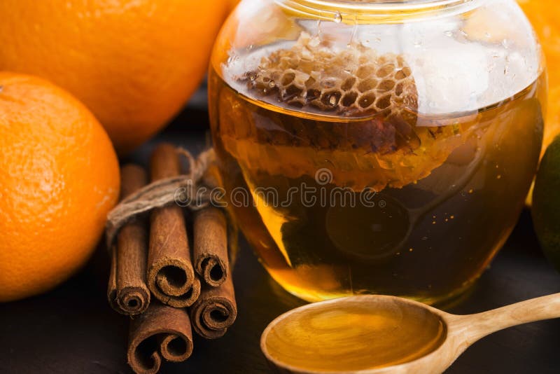 Honey with Citrus Fruit and Cinnamon Stock Photo - Image of liquid ...