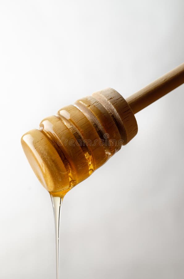 Honey Dripping de Drizzler en bois photographie stock Honey Dripping de Drizzler en bois photographie stock