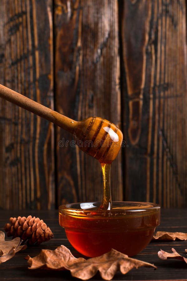 Honey Flows from a Stick into a Jar. Rustic Sweet Autumn Photo, Wooden ...