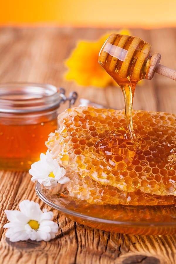 Honey In Jar With Honeycomb And Wooden Drizzler Stock