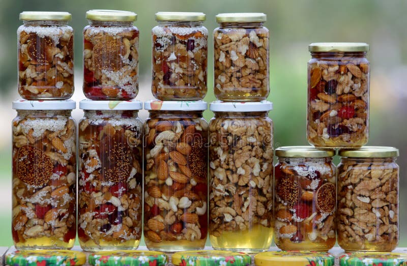 Honey with nuts and fruits stock photo. Image of herbs 46095924